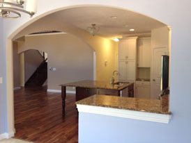 arched-doorways-open-concept-large-kitchen-island-wood-floors